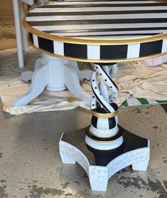 a black and white table with gold trim