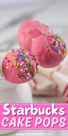 two pink cake pops with sprinkles on top and the words starbucks's cake pops above them