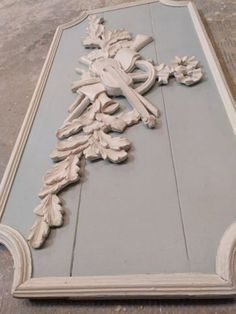 an ornately carved wooden frame with a cross on it