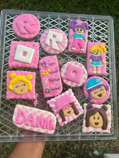 some decorated cookies are sitting on a wire rack