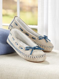 These fun mocs add a pop of color in an enduring style that's a favorite for its casual looks and easy fit. The soft suede upper is saturated in color and crafted with working "skip laces" and topstitch detailing. The inside is lined with quilted brushed terry that surrounds the deep memory foam footbed. Slip-on moccasin-style slippers Soft suede upper Lined with quilted brushed terry Deep memory foam footbed Working skip lacing adjusts for the most comfortable fit EVA rubber outsole Upper, sued Luxury Designer Plain Toe Moccasins, Luxury White Moccasins With Branded Insole, Luxury Chic Round Toe Moccasins, Luxury Modern Moccasins With Flat Heel, Luxury Flat Moccasins For Formal Occasions, Chic Luxury Moccasins For Workwear, Elegant Luxury Low-top Moccasins, Luxury Modern Flat Heel Moccasins, Luxury Beige Women's Moccasins