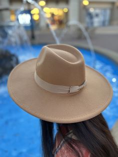 "This beautiful felt wide brim hat is the perfect accessory to add to all your fav summer outfits. We love the band accent, it's such a sassy way to spice up a classic hat. Plus we adore the soft felt material for a stylish look. Pair it with a long flowing maxi or keep it casual with jeans and a blouse! 100% polyester Approximately 23\" around the head Brim Width: 3.5\" Colors may vary from different viewing devices A brushed woven fedora featuring a wide brim and velvet trim. - 100% polyester Fedora For Country Events With Flat Crown, Trendy Fedora Felt Hat For Rodeo, Trendy Curved Brim Felt Hat For Rodeo, Trendy Felt Hat With Curved Brim For Rodeo, Trendy Brimmed Felt Hat For Country Events, Rodeo Fedora Felt Hat For Kentucky Derby, Elegant Fedora Felt Hat For Rodeo, Elegant Felt Hat For Country Events In Fall, Solid Color Wide Brim Felt Hat For Kentucky Derby