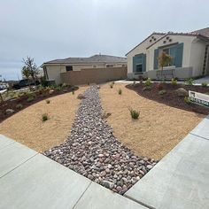 a gravel path in front of a house