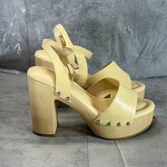 Sarto By Franco Sarto Women's Lemon Leather Wally Ankle Strap Platform Sandals Sz 7 Bold Studs Faux-Wood Platform 4 1/4" Heel; 1 1/2" Platform Leather Upper/Synthetic Lining And Sole Made In Brazil This Is A New Without Tags/Box Item. Please Refer To Images. Chic Wedge Sandals With Wooden Heel And Ankle Strap, Chic Ankle Strap Wedge Sandals With Wooden Heel, Chic Yellow Leather Wedge Sandals, Yellow Wedge Sandals With Ankle Strap, Yellow Ankle Strap Wedge Sandals, Yellow Ankle Strap Sandals With Wrapped Heel, Yellow Sandals With Wrapped Heel And Ankle Strap, Yellow Sandals With Wooden Heel For Spring, Yellow Ankle Strap Heels With Heel Loop