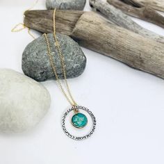 A bright pop of turquoise hangs within a hand forged sterling pendant that has been intricately stamped with tiny circle details. This simple pendant hangs from a delicate 14k gold filled chain. From our Gems and Details Collection. #daintyjewelry #turquoisependant #minimalstyle •Sterling silver and 14k gold filled •Turquoise •Pendant is about 3/4" •Length: 17" Everyday Turquoise Brass Jewelry, Hammered Turquoise Sterling Silver Jewelry, Turquoise Hammered Sterling Silver Jewelry, Gold Turquoise Pendant Necklace In Sterling Silver, Bright Pop, Simple Pendant, Sterling Pendant, Jewelry Repair, Turquoise Pendant