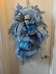 a blue wreath hanging on the front door