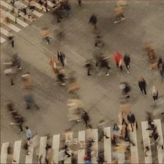 an aerial view of people walking on the street