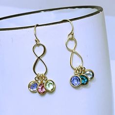 "Initials and/or Birthstones, at checkout please. Initial/Birthstone? At checkout please.Awesome Earrings with beautiful Swarovski crystal birthstones of your love one!! fine and delicate earrings just take a look!! @MONYART ORIGINAL DESIGN.* Truly one of a kind! Please sellers don't copy! ツ Trust in yourself....make your own designs!! You are great!! :) Copyright author. . Anklet, Bracelets, Earrings? http://etsy.me/YsdRNv Need more Birthstones, initials, charms, etc, ? http://etsy.me/UFmfXa FE Gold Infinity Earrings Perfect For Gifts, Hypoallergenic Infinity Sterling Silver Earrings, Hypoallergenic Infinity Earrings For Gift, Earrings For Mom, Awesome Earrings, Infinity Earrings, Unique Handmade Earrings, Family Jewelry, Niagara Falls Ny