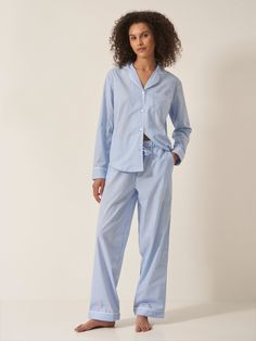 Designed to feel both classic and contemporary, and cut for a relaxed yet tailored fit, this Blue & White Stripe 100% organic GOTS certified cotton pyjama set will brighten your nights and mornings with its vibrant all-over print. With contrast piped trims throughout, the bottoms come with handy slip pockets at sides and a drawstring elasticated waistband with fabric self-tie. If you like your pjs cut a little more generously we recommend going up a size. 100% organic GOTS certified cotton Contr Blue Pyjamas, Striped Pyjama, Pyjama Sets, Cotton Pajama Sets, Nightwear Women, Womens Pyjama Sets, Silk Pajamas, Cotton Pyjamas, Cloud 9