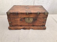 an old wooden chest with brass handles