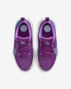 a pair of purple and blue sneakers on a white background