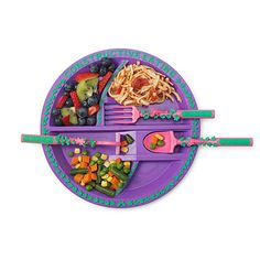 a purple plate topped with lots of different types of food and utensils on top of it