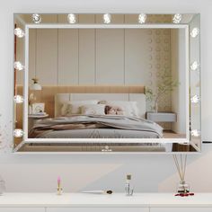 a bedroom with a large mirror on the wall above it and a bed in front of it