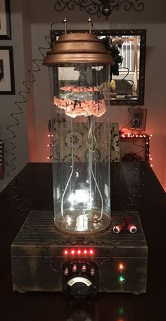 an old fashioned radio sitting on top of a table with some lights in the background