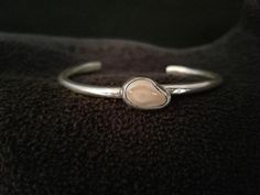 Please note that this item is made to order. The production time is about 10 days. A teardrop shape genuine elk tooth clutched in delicate sterling silver makes this a special gift. Handmade using retrieved elk ivory from Montana. Cuff size: 7" * If you would like other sizes, please choose "Anther size" from drop-down menu and put the cuff size that you would like at the box at check out says "Notes to Distinctly Montana Gifts" ** You can USE YOUR OWN IVORY at no additional cost! Yes, it's poss Elk Ivory Bracelet, Elk Tooth Jewelry, Elk Ivory Necklace, Elk Ivory Ring, Elk Ivory Jewelry, Elk Ivory, Ivory Jewelry, Ivory Necklace, Teeth Jewelry