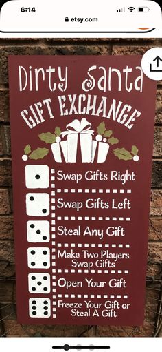 a sign that is on the side of a brick wall saying dirty santa gift exchange