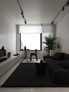 a living room filled with furniture and a flat screen tv on top of a wall