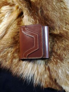 A beautiful vegetable tanned leather wallet of "high class" quality in three sections. Tan color with stitched pattern on the front Compact: 5 spaces for cards (Each space can accommodate at least two. ) Space for tickets Stores in the back pocket of the pants Dimensions closed: 3 3/4 x 41/8 " 9.5 x 10.5 cm Available in other classic colors on request. Possibility of two colors on the same wallet. It is then necessary to count a maximum of 4 days before sending. Do not hesitate to contact me if Hand-stitched Leather Trifold Wallet, Hand-stitched Leather Rectangular Coin Purse, Hand-stitched Rectangular Leather Coin Purse, Classic Leather Trifold Wallet Hand-stitched, Hand-stitched Trifold Wallet For Everyday Use, Rectangular Cognac Leather Trifold Wallet, Cognac Leather Trifold Wallet, Cognac Leather Rectangular Trifold Wallet, Hand-stitched Brown Leather Coin Purse