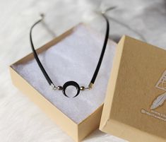 This choker necklace is made with genuine black leather lace adorned with carved horn black moon and pyrite stone beads. You can choose the stone you want on the last picture. ➵ Matching earrings: https://www.etsy.com/fr/listing/502723862/boucles-doreille-croissant-lune-long?ref=shop_home_active_1➳ Others chokers: https://www.etsy.com/fr/listing/516046883/collier-ras-du-cou-choker-tour-de-cou?ref=shop_home_active_8------ ▲ ▲ ▲ ------SIZE:> Chain length: 32 cm (37 cm with the little chain)Clos Chokers Necklace, Pyrite Stone, Choker Black, Double Black, Leather Choker Necklace, Necklace Leather, Stone Choker, Boho Choker, Black Moon