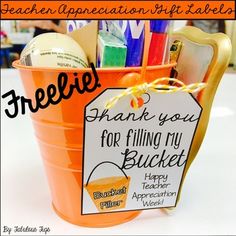 an orange bucket filled with office supplies and a thank you for filling my bucket sign