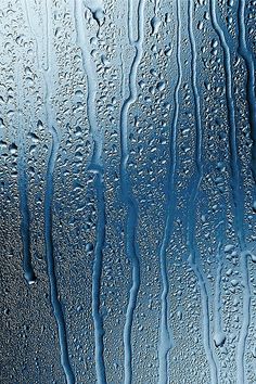 water drops on the glass surface as it is raining