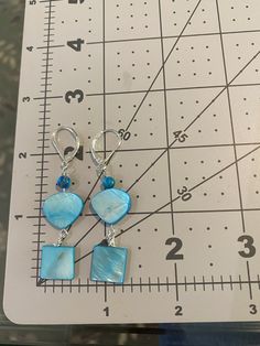 Turquoise colored shapes make up this cute necklace and dangle earring set. Pearl Necklace And Earring Set, Mother Of Pearl Necklace, Necklace And Earring Set, Cute Necklace, Color Shapes, Turquoise Color, Wire Wrapped Jewelry, Mother Of Pearl, Earring Set