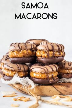 chocolate covered macarons are stacked on a wooden platter with text overlay