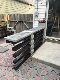 an outdoor bench made out of concrete blocks