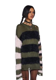 This sweater has a stretchy loose knit yarn construction, fuzzy faux fur detailing, a striped design, distressed detailing, and an oversized fit. Game Dino, Current Mood Clothing, Friend Costumes, Costume Store, Current Mood, Blue Gingham, Sweater Design, Green Sweater, Oversized Sweater