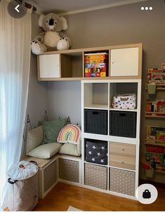 a child's room with toys and bookshelves on the shelves, including a teddy bear