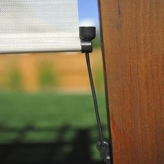 the side of a wooden fence with a closed window