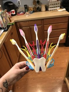 a toothbrush holder made out of toothbrushes