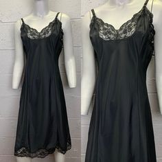 Vintage black matte crepe remarque slip dress with lace trim by Barbizon. Black nylon, polyester and rayon blend with a smooth matte finish. Lace trim at the bust and at the hem.  Adjustable ribbon straps.  Good condition. No noted flaws. Tagged size 38 Fits like a size Medium/Large. Laid flat and measured. Fabric has no stretch. Bust (armpit to armpit) - 19 inches Waist - 17 inches Hips - 22 inches Length - 44 at the longest setting Black Lace Slip Dress With Bias Cut, Black Lace Trim Camisole Slip Dress, Black Lace Bias Cut Slip Dress, Black Camisole Slip Dress With Lace Trim, Black Slip Dress With Contrast Lace For Night Out, Elegant Black Slip Dress With Lace Trim, Elegant Black Lace Trim Slip Dress, Fitted Black Slip Dress With Lace Trim, Fitted Lace Trim Slip Dress For Night