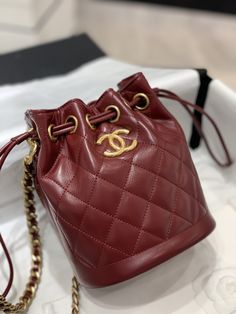 SHOP MORE LUXURY PRODUCTS HERE Description Chanel Small Drawstring Bucket Red Bag For Women 19cm/7.5in Size: 19 x 15 x 12.5 cm / 7.5 x 6 x 5 in Golden MetalCC logoRed Includes dust bag.This product is of the premium quality. Luxury Red Formal Pouch, Luxury Red Pouch Bucket Bag, Louis Vuitton Shirt, Chanel Shirt, Book Tote Bag, Dior Book Tote, Red Bag, Gucci Gg Marmont, Luxury Products