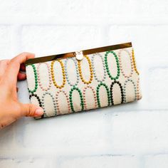 "Perfect gift for your special one! A bi-fold clasp clutch wallet with a pull-through metal clasp. Handmade with multicolor oval embroidery fabric as exterior and green color pure cotton as interior. Very neatly handmade. Each unit has 12 card slots, 1 zipper pocket and 2 bill pockets that will accommodate an iPhone plus in a case on either side. Toss it in your purse to double as a wallet. Perfect Gift for your wife, mom or special one for every day use! Dimensions: 7.5\" x 4.1\" x 0.7\" To che Elegant Multicolor Clutch Wallet, Elegant Multicolor Wallet For Daily Use, Elegant Multicolor Wallets For Everyday Use, Elegant Multicolor Wallets For Daily Use, Oval Embroidery, Women Embroidery, Fabric Wallet, Cute Womens, Womens Wallet