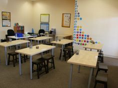 an empty classroom with desks and chairs