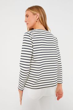 An ideal style for running errands, grabbing lunch with friends, or shopping around town, the Navy Stripe Manon Popover is effortless and oh-so-classic. This top boasts bracelet-length sleeves, a front lace-up tie closure, and a striped pattern that you cannot go wrong with. Pair with denim shorts and sneakers or with pants and sandals for an easy everyday look. V-neckline with front lace-up closure Bracelet-length sleeves Boxy fit Striped pattern Material: 70% Cotton, 30% Polyester Care: Hand w Classic Tops For Day Out In Fall, Classic Stretch Top For Day Out, Chic Cotton Crew Neck Long Sleeve Top, Chic Cotton Long Sleeve Crew Neck Top, Chic Long Sleeve Cotton Crew Neck Top, Casual Stretch Long Sleeve Top For Work, Casual Long Sleeve Top For Spring, Chic Cotton Long Sleeve Top For Work, Casual Long Sleeve Top For Everyday Spring Wear