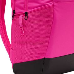 Grab your gear and get going with the Nike Brasilia Backpack. It has plenty of pockets to help you stay organized, including a sleeve to fit your laptop, side mesh pockets for water bottles, and a zippered pocket on the inside to keep small items secure. This product is made with at least 50% recycled polyester fibers. Haul loop at the top. Spacious main compartment. Padded, adjustable shoulder straps. Front zip pocket. Internal laptop sleeve. Dimensions: 18" H x 12" W x 7" D. Capacity: 24 L. Sh Nike Functional Backpack For Outdoor Activities, Functional Pink Outdoor Backpack, Pink Functional Outdoor Backpack, Nike Nylon Backpack For Travel, Pink Nylon Outdoor Backpack, Nike Nylon Travel Backpack, Pink School Bag With Water Bottle Pocket, Nike Nylon Backpack For Outdoor Activities, Pink Backpack With Water Bottle Pocket