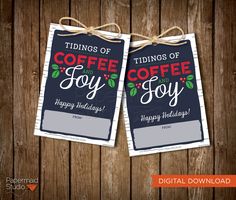 two tags with coffee and joy on them are hanging from the string, against a wooden background