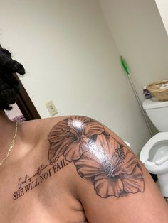 a woman with a flower tattoo on her chest and the words she will not fail