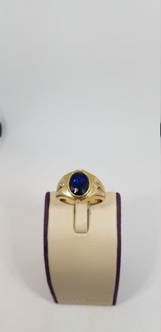 "Vintage 14K Yellow Gold CZ Ring, Size 10. Stamped 14K twice inside band. Blue stone is 10 x 8mm. Weighs 5.4 dwt. Please stop in often as we will be adding additional vintage fine jewelry beauties. Note that the letter/number combo in the title is for our purposes only. We do not check prongs for wear or stones for looseness. All items are sold as is-noting that we are a resale shop so everything here had a previous owner! We will include flaws in the description when noted. This is one of the r Oval Sapphire Signet Ring In 14k Gold, Formal Oval Sapphire Signet Ring, Formal Sapphire Oval Signet Ring, Classic Sapphire Ring Stamped 14k, Formal Sapphire Diamond Ring In 14k Gold, Formal 14k Gold Oval Sapphire Ring, Formal Oval Sapphire Ring In 14k Gold, Oval Sapphire Ring Stamped 14k For Formal Occasions, 14k Gold Sapphire Signet Ring For Anniversary