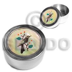 two round metal containers with birds on them