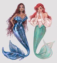 two mermaids are standing next to each other