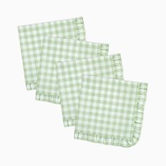 three green gingham napkins with ruffled edges