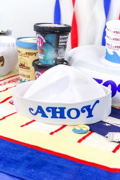 the table is covered with ice cream, yogurt and other items