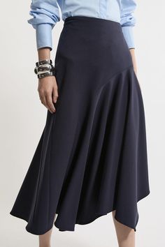 Elevate Your Occasion Wear Wardrobe With Our Midi Skirt, With A Flared Silhouette, And An Asymmetric Hemline Which Gives A Unique Edge. Style It With The Matching Jacket And Strappy Heels For An Occasion Look That Is Guaranteed To Turn Heads Wherever You Step. Tailored Asymmetric Drape Midi Skirt High Quality Crepe Fabric Flared, Relaxed Fit Unique Asymmetric Hemline Comfortable, High Waistline