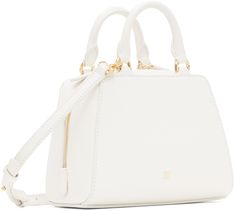 Structured and tumbled buffalo leather top handle bag in white. · Twin rolled carry handles · Adjustable and detachable crossbody strap · Logo stamp at face and back face · Two-way zip closure · Card slot at interior · Canvas lining · Logo-engraved gold-tone hardware · H5.5 x W6.5 x D3.5 Supplier color: Ivory Cube Bag, Givenchy Antigona, Givenchy Logo, Givenchy Bag, Bags Logo, Buffalo Leather, Travel Collection, Logo Stamp, Color Ivory