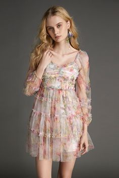 This dress is a must for your new season wardrobe. Featuring a floral print mesh material with a V-neckline, long sleeves, a ruched bodice, ruffled trimming throughout, and a tiered A-line mini skirt. Team this with heeled mules and a shoulder bag to complete the look. No Stretch Medium Weight Size runs small，recommend one size up Fabric: 100% Polyester Model is 175cm/5'8" tall, 82cm/32" bust, 60cm/24" waist and 89cm/35" hip and wears a size M. Care Instruction: Machine Wash at or below 30°C, Do not bleach, Line dry in shade, Iron cool (max 110â„?, Dry clean, tetrachloroethylene(PCE) only.Please note: The images represent actual product though color of the image and product may slightly differ. This item will be shipped within 10 business days. SKU: W2202BA2695JPFSSKU: ${data.sku} Long Sleeve Chiffon Dress With Ruched Details, Spring Long Sleeve Dress With Ruffles, Spring Floral Long Sleeve Dress With Ruffles, Spring Garden Party Dress With Sheer Sleeves, Ruched Floral Dress For Spring Brunch, Spring Floral Dress With Ruched Detail For Brunch, Chic Summer Long Sleeve Dress With Ruffles, Feminine Floral Dress With Ruffles For Fall, Long Sleeve Floral Dress With Ruffles For Brunch