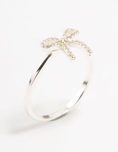 Elevate your signature style with stunning sterling silver pieces. This flirty bow motif ring, adorned with cubic zirconia crystals, crafted from genuine 925 sterling silver, ensures durability and chic sophistication. Material: Crystal, Cubic Zirconia, Sterling Silver Dimensions: Diameter 17 mm x Band Width 1 mm | Lovisa Sterling Silver Cubic Zirconia Bow Ring, Size: XS/S, Clear Bow Ring, Silver Pieces, Stylish Jewelry, Signature Style, Cubic Zirconia, Silver Rings, 925 Sterling Silver, Band, Sterling Silver