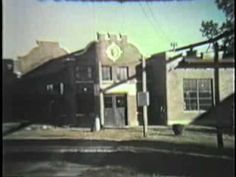 an old building with a clock on the front